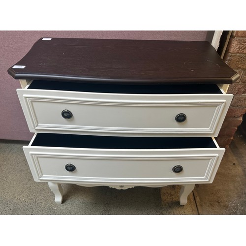 1461 - A white three drawer chest with contrast top