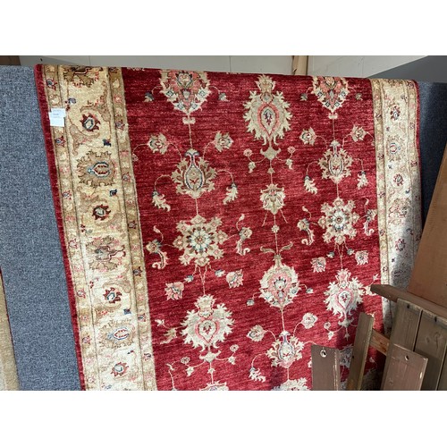 1513 - A hand woven all over floral design cream and auburn rug, 96 inch x 68 inch