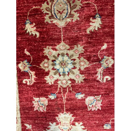 1513 - A hand woven all over floral design cream and auburn rug, 96 inch x 68 inch