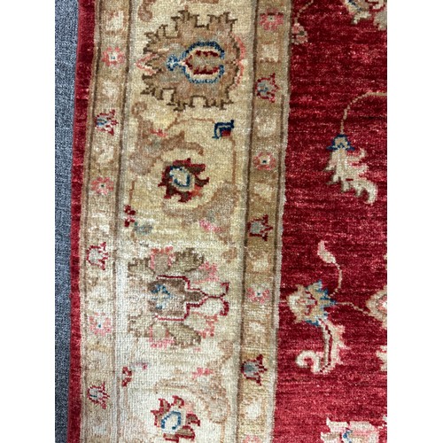 1513 - A hand woven all over floral design cream and auburn rug, 96 inch x 68 inch