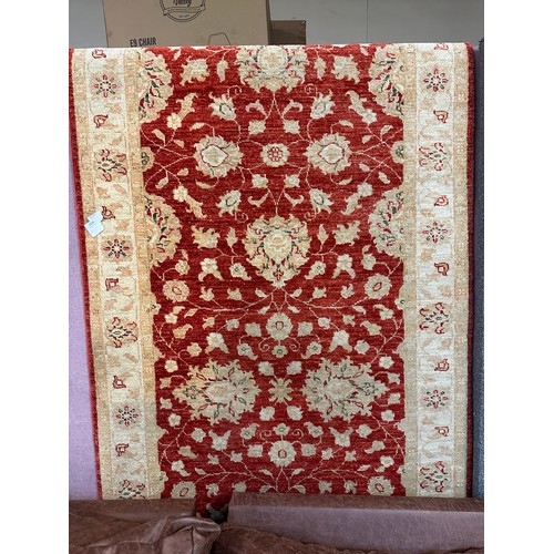 1514 - A hand woven all over floral design cream and auburn rug, 115 inch x 39.5 inch