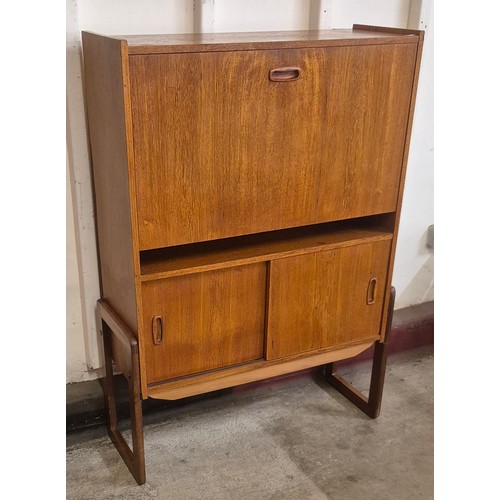 6 - A teak writing cabinet