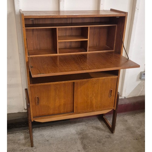 6 - A teak writing cabinet