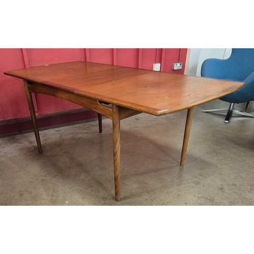 11 - A G-Plan Brasilia teak extending dining table