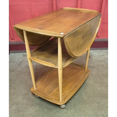 14 - An Ercol Blonde elm and beech drop leaf trolley