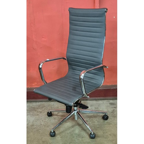 38 - An Eames style chrome and grey leather revolving desk chair