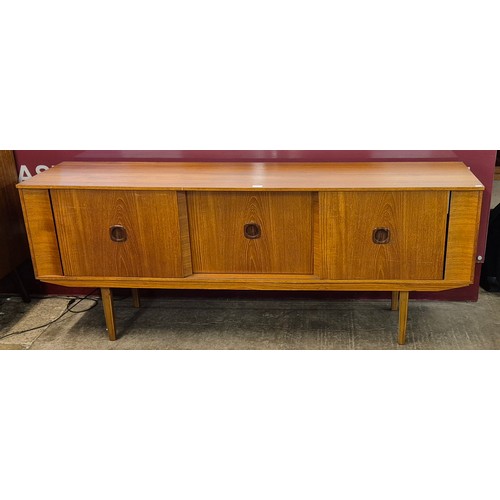 25 - A teak sideboard