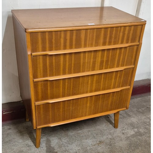 27 - A teak chest of drawers