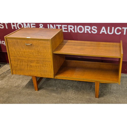 32 - A teak record cabinet