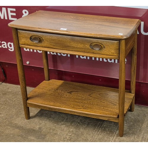 39 - An Ercol Golden Dawn ash single drawer console table