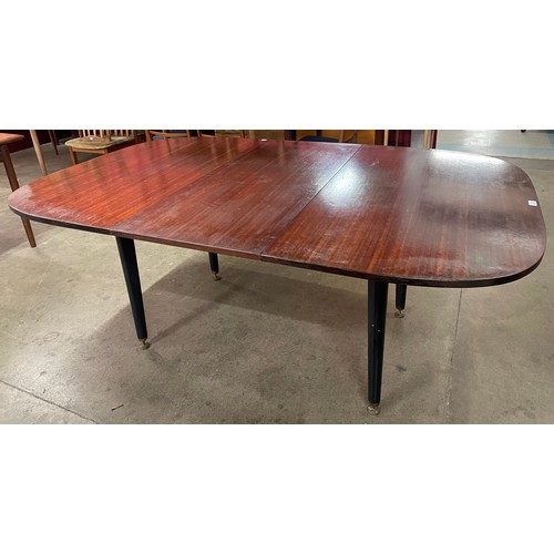 21 - A G-Plan Librenza tola wood and black extending dining table