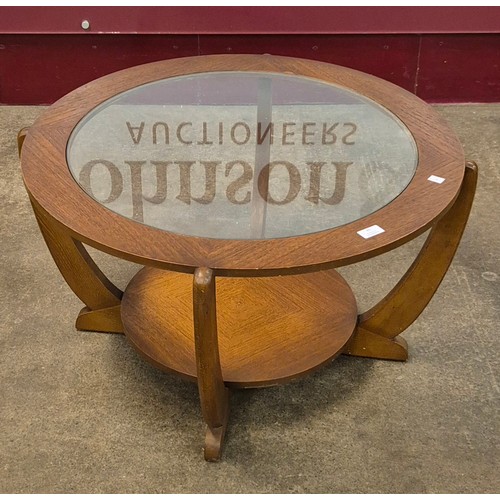 41 - A Stonehill teak and glass topped circular coffee table