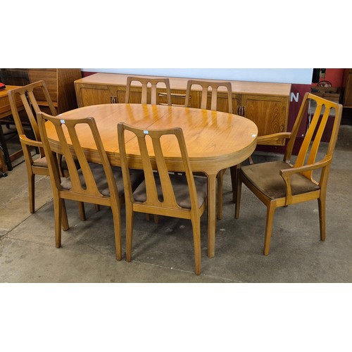 43 - A Nathan teak oval extending dining table and six chairs