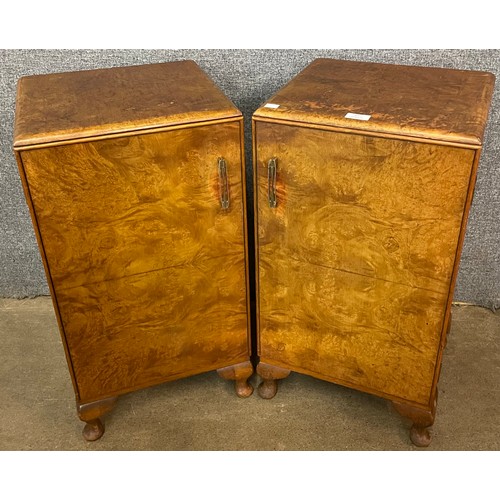 107 - A pair of Art Deco walnut bedside cabinets