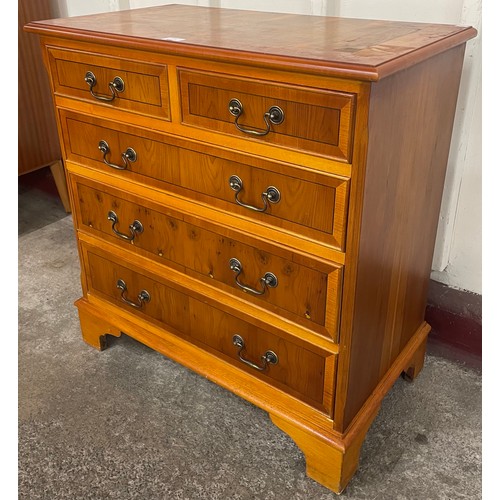 110 - A George III style yew wood chest of drawers