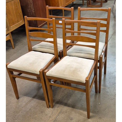 47 - A set of four teak dining chairs