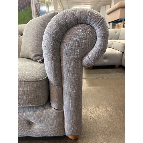 3170 - A grey weave Chesterfield two seater sofa