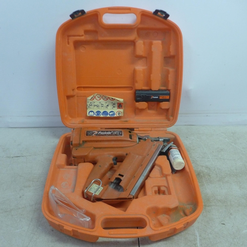 5021 - A Paslode Impulse IM3501/90CT nail gun in case with a bottle of Paslode cordless aceite lubricating ... 