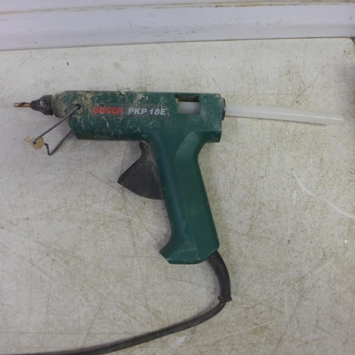 5025 - A Bosch PKP18E, 240V hot glue gun with a pack of 190mm glue sticks and a Milwaukee M12 BD 12v cordle... 