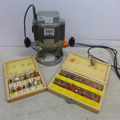 5027 - An ELU MOF 117102 router with two assorted router sets including a 12 pc Jackson router cutter set