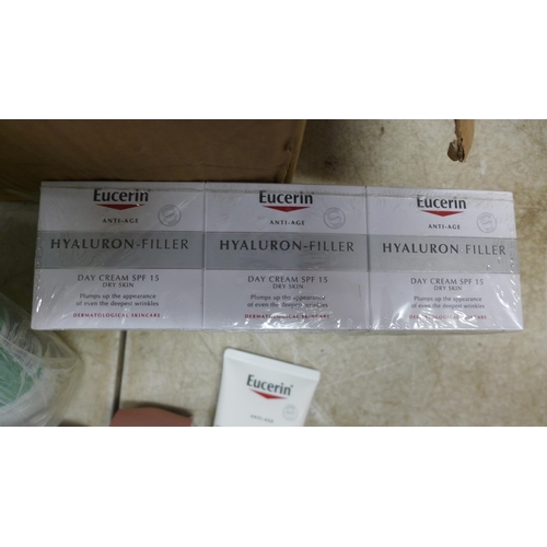 5064 - A box of assorted cosmetics including Eucerin Dermo Purifyer Oil Control Scrub and Eucerin Hyaluron-... 