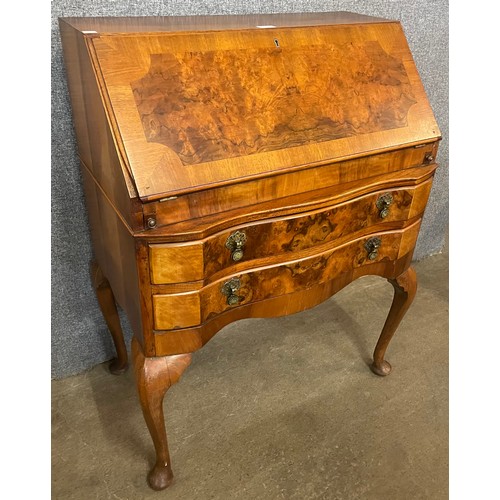 116 - A Queen Anne figured walnut bureau de dame