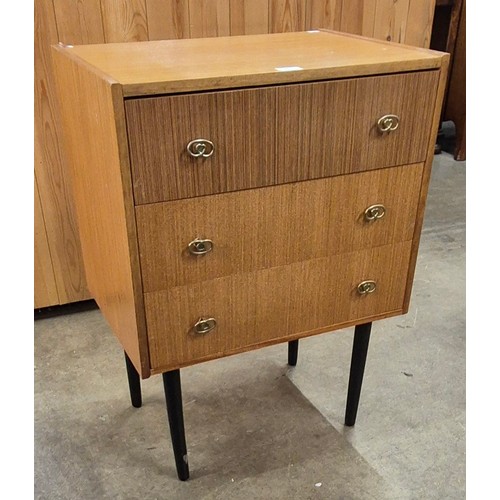 69 - A small teak chest of drawers