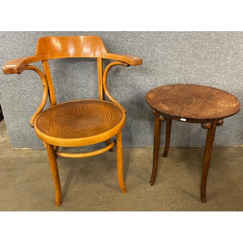 123 - A beech bentwood elbow chair and a mahogany occasional table