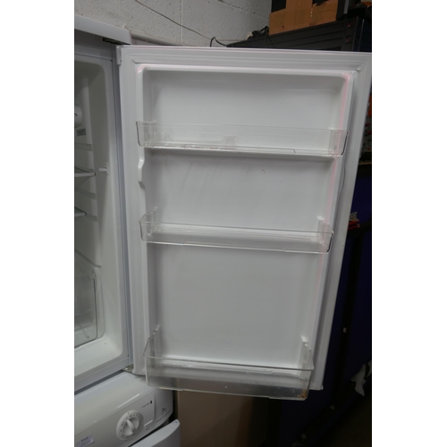 5113 - A Bush M5085UCL under counter free standing fridge