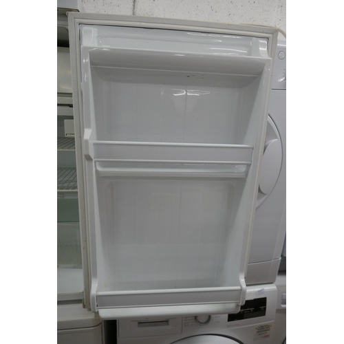 5120 - An Indesit GR1403 free standing under counter fridge