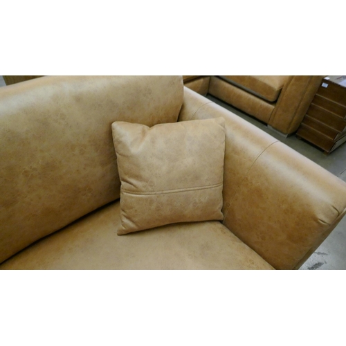 3003 - A tan suede effect love seat