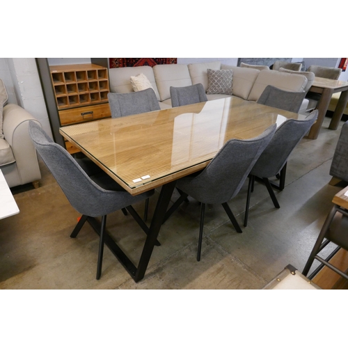 3031 - An Iconic dining table and six grey upholstered chairs  * This lot is subject to VAT