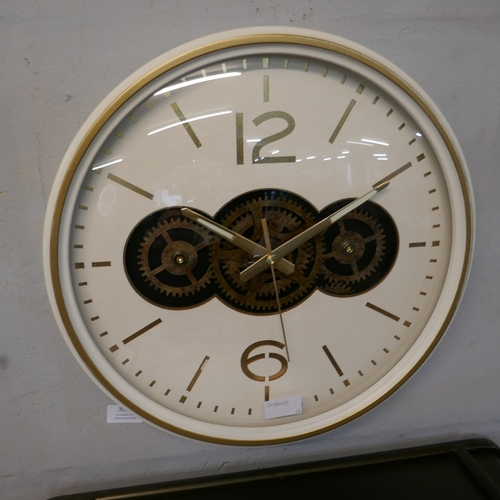 3034 - A cream moving gears wall clock