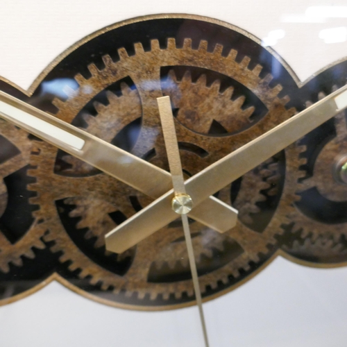 3034 - A cream moving gears wall clock