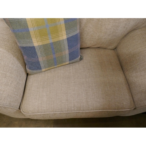 3054 - An oatmeal compact three seater sofa and armchair