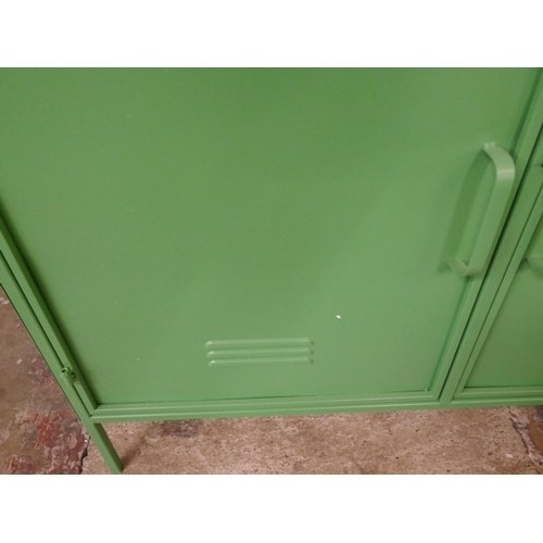 3065 - A large green industrial style cabinet