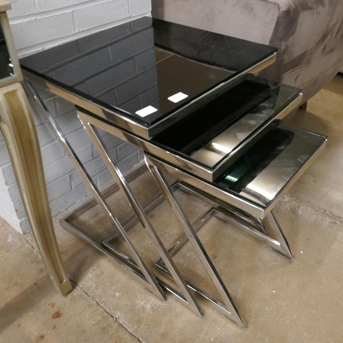 3068A - Glass and chrome nest of three tables *This lot is subject to VAT