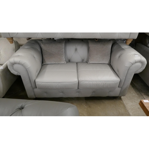 3094 - A stone leather Chesterfield 2.5 seater sofa RRP £1379