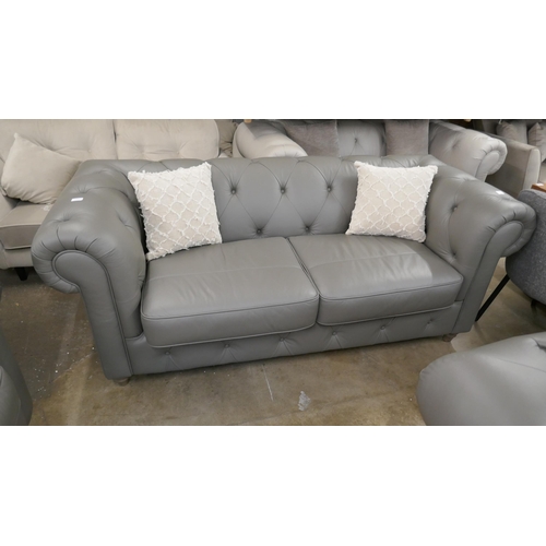 3097 - A grey leather Chesterfield three seater sofa