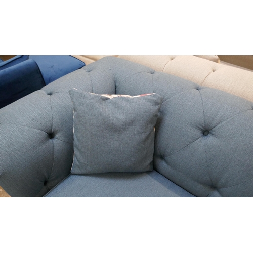 3100 - A blue upholstered Chesterfield three seater sofa-bed