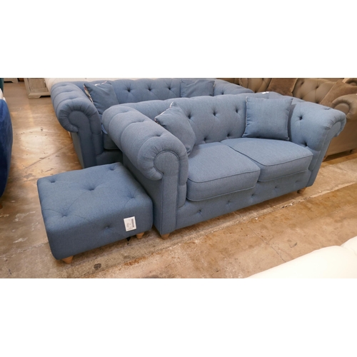 3101 - A blue upholstered Chesterfield two seater sofa and footstool