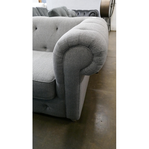 3109 - A grey upholstered Chesterfield three seater sofa