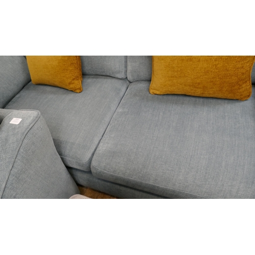 3110 - A blue upholstered three seater sofa and armchair