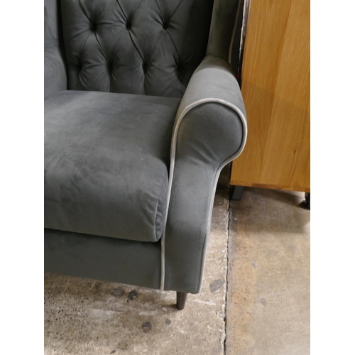 3113 - A grey velvet wingback armchair