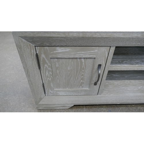 3147 - An Oak Furnitureland two door TV stand