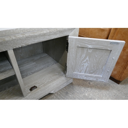 3147 - An Oak Furnitureland two door TV stand