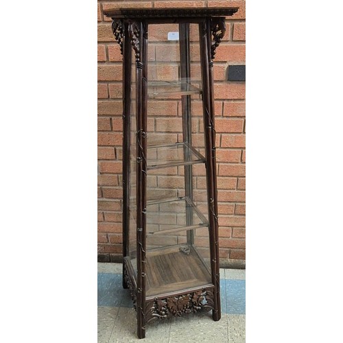 86 - An early 20th Century Chinese carved Hongmu rosewood display cabinet