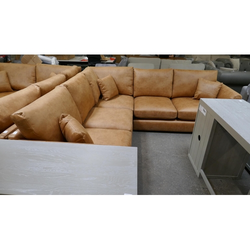 3149 - A large tan suede effect corner sofa