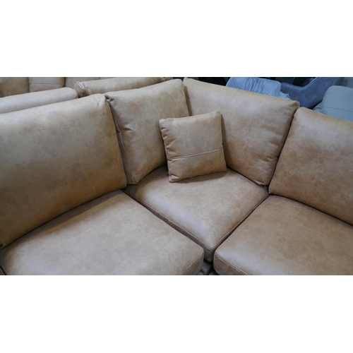 3149 - A large tan suede effect corner sofa