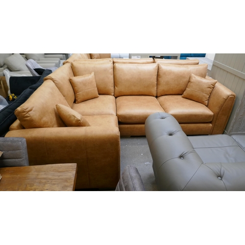 3149 - A large tan suede effect corner sofa